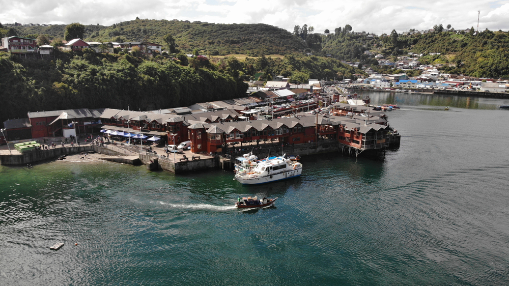 aerial,view,from,angelmo,market,,harbour,,docks,and,green,hills