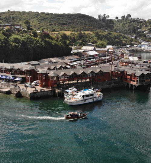 aerial,view,from,angelmo,market,,harbour,,docks,and,green,hills